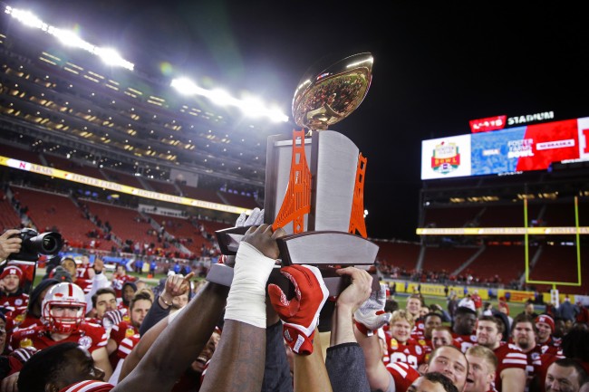 Nebraska players lift the champions trophy after a 37-29 win over UCLA during the  Foster Farms Bowl NCAA college football game Saturday, Dec. 26, 2015, in Santa Clara, Calif. (AP Photo/Marcio Jose Sanchez)